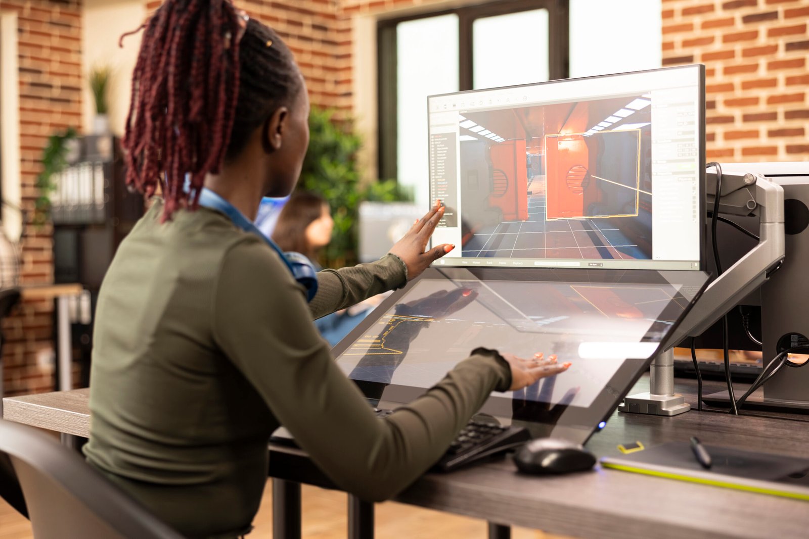 designer working on video and 3d models